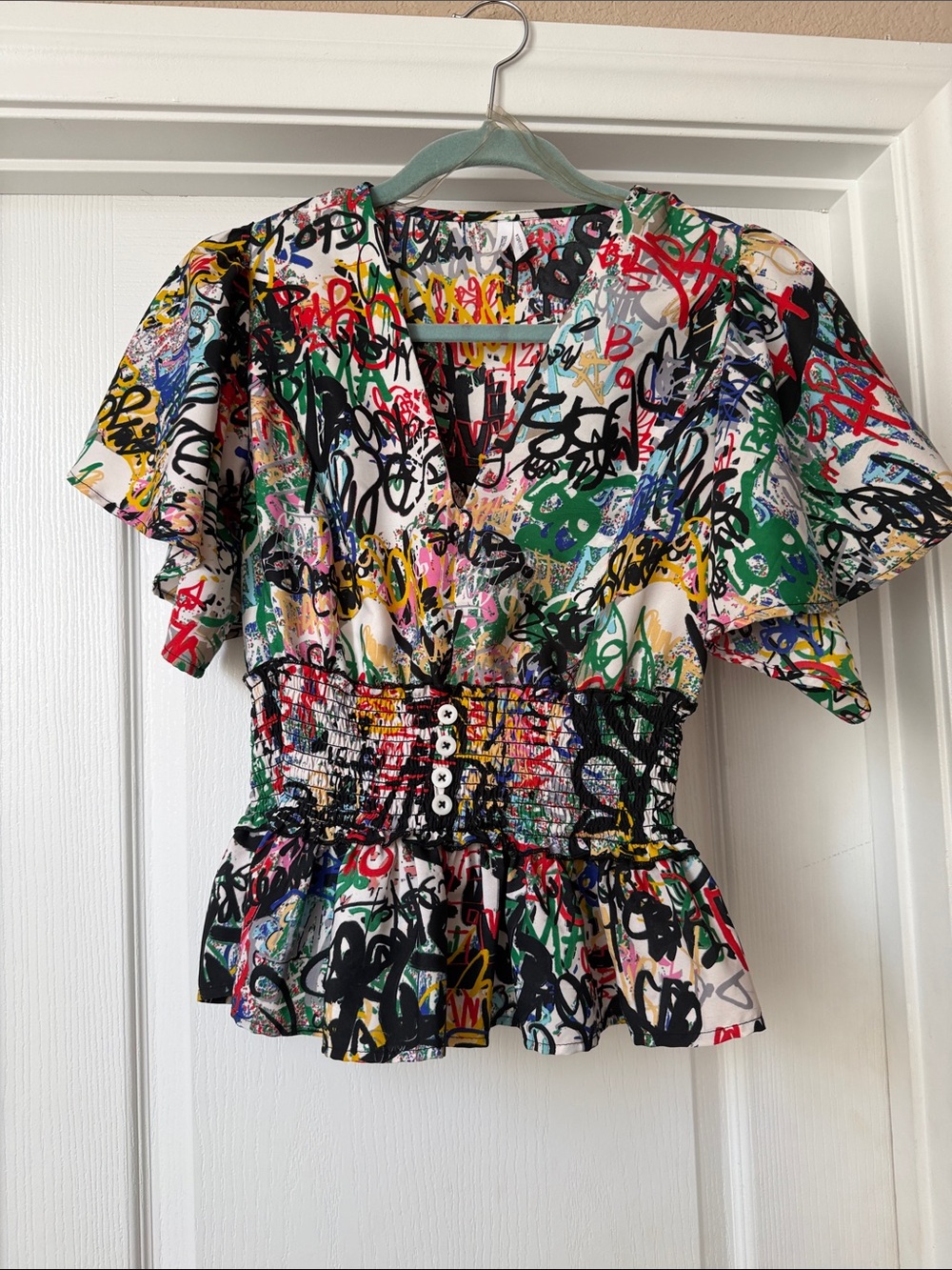 Live 4 Truth Multicolor Graffiti Smocked V-Neck Peplum Top